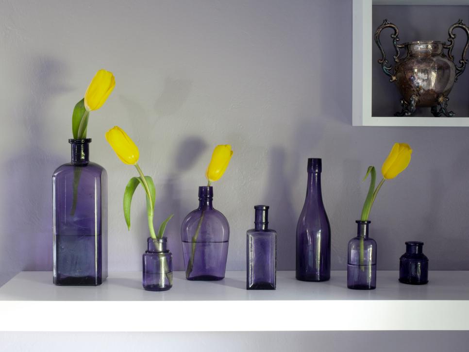 Floating Shelf with Purple Bottles with Yellow Flowers 