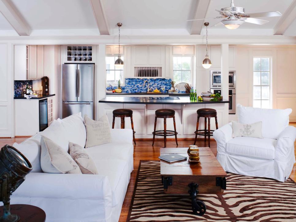 White Open Kitchen and Living Room With Zebra Print Rug