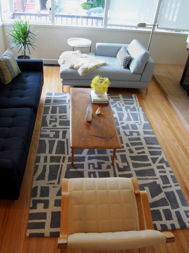 Neutral Contemporary Living Room With Blue Sofa and Chaise and Graphic Rug Neutral Contemporary Living Room With Blue Sofa and Chaise and Graphic Rug