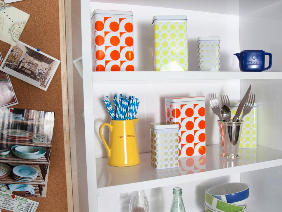 Colorful Canisters on White Kitchen Shelves