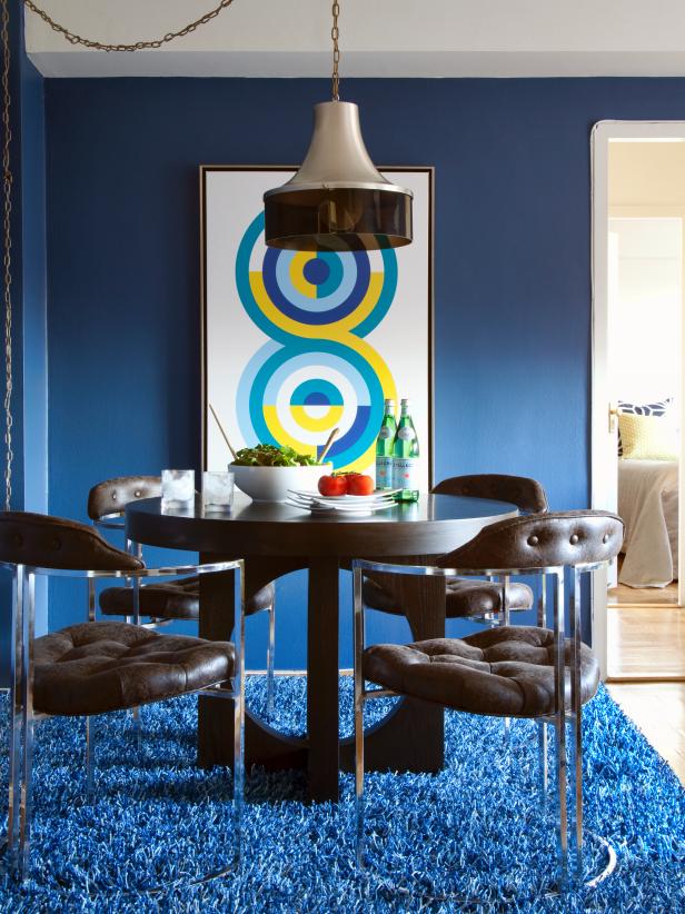 Contemporary Dining Room With Dark Wood Table and Blue Shag Carpet