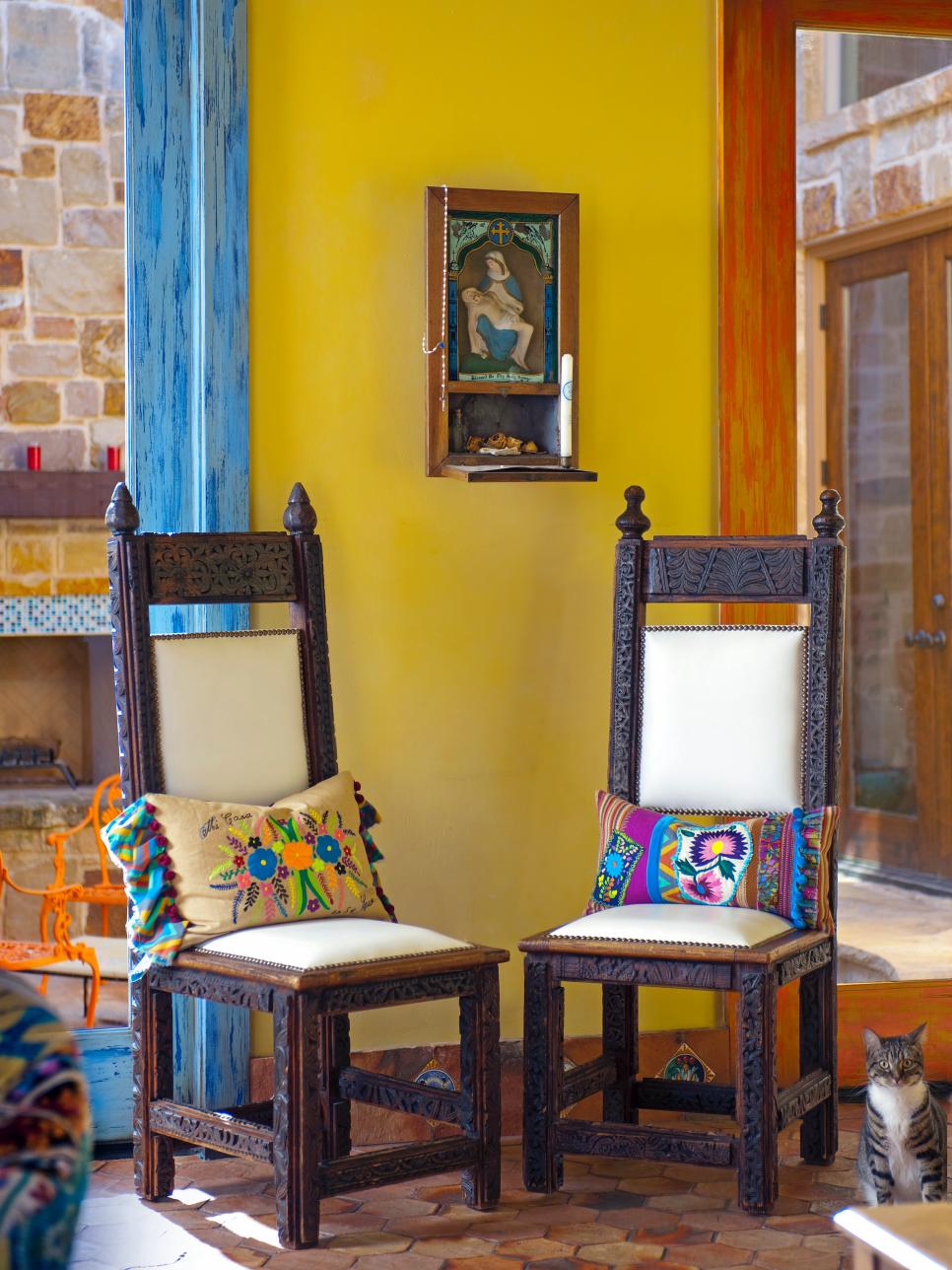 Antique Carved Chairs in Mediterranean-Style Yellow Room