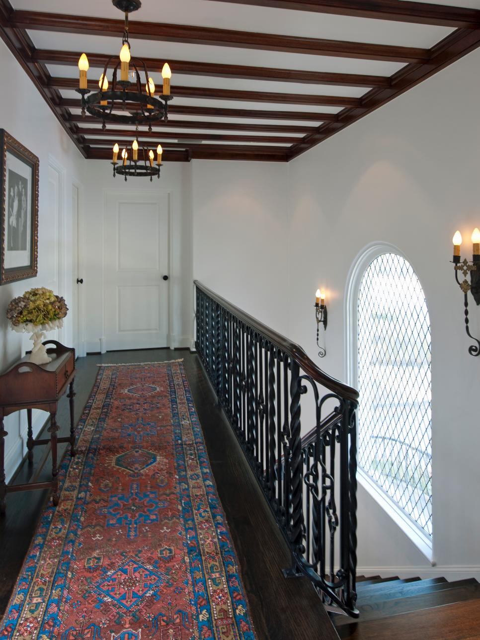 Mediterranean Hallway With Beamed Ceiling Mediterranean Hallway and Stairs With Wrought Iron Railing