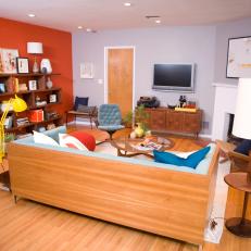 Fun Living Room With Brightly Colored Accents and Orange Wall