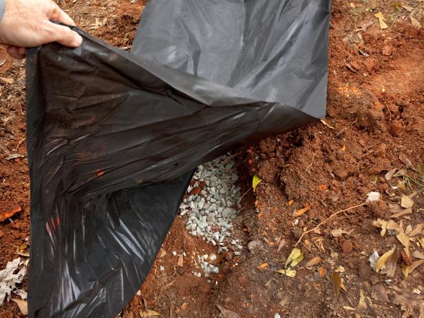 Covering Ditch and Rocks With Black Garbage Bag Covering Ditch and Rocks With Black Garbage Bag