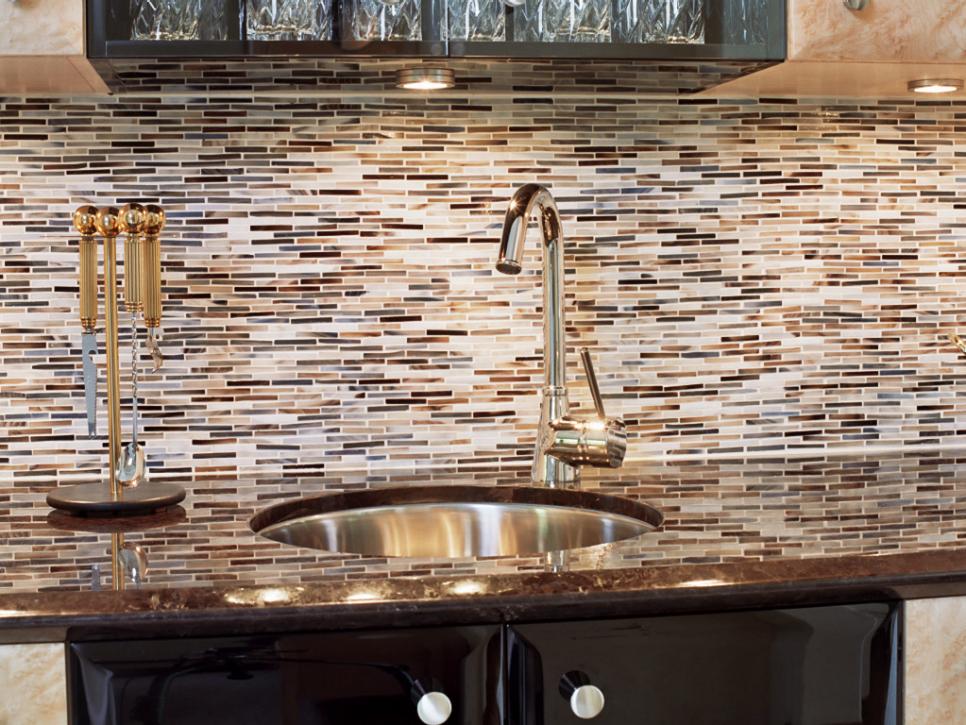 Brown, Gray and White Tile Backsplash With Metal Sink and Faucet