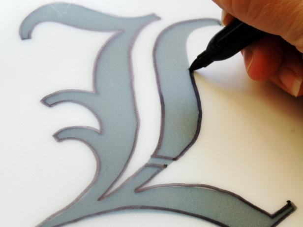 Using a computer, design stencil in a word processor program and print. (Old English font in 400 point was used for this project.) The design can be a monogram, significant date or random typography.
