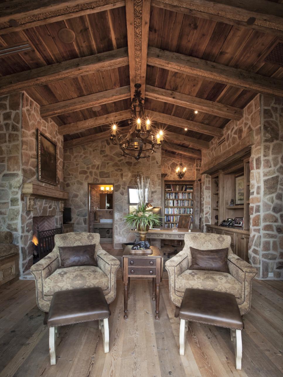 Stone Office With Upholstered Chairs, Wood Ceiling and Stone Walls