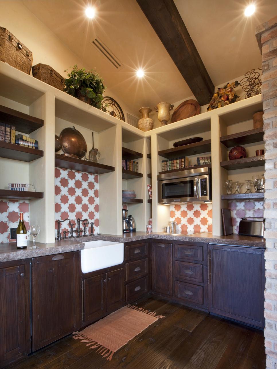 Old World Kitchen With Dark Wood Cabinetry and White Shelving