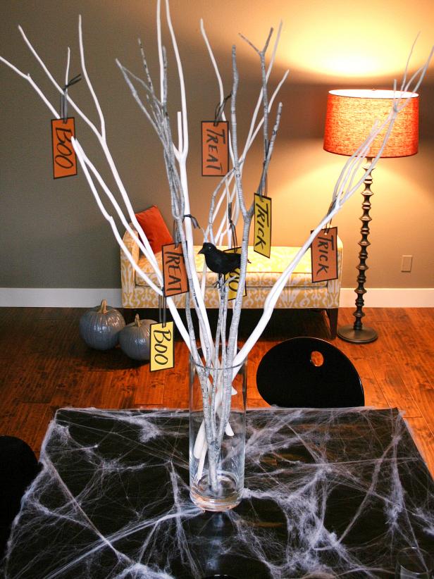 Halloween Centerpiece With White Branches, Paper Tags and Black Crow
