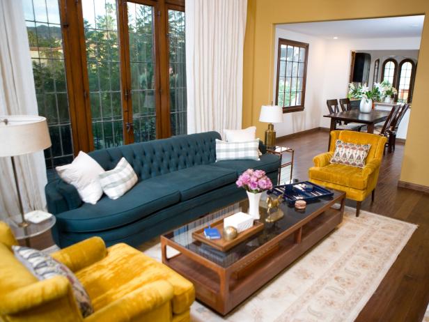 Chic Living Room With Blue Tufted Sofa and Gold Velvet ...