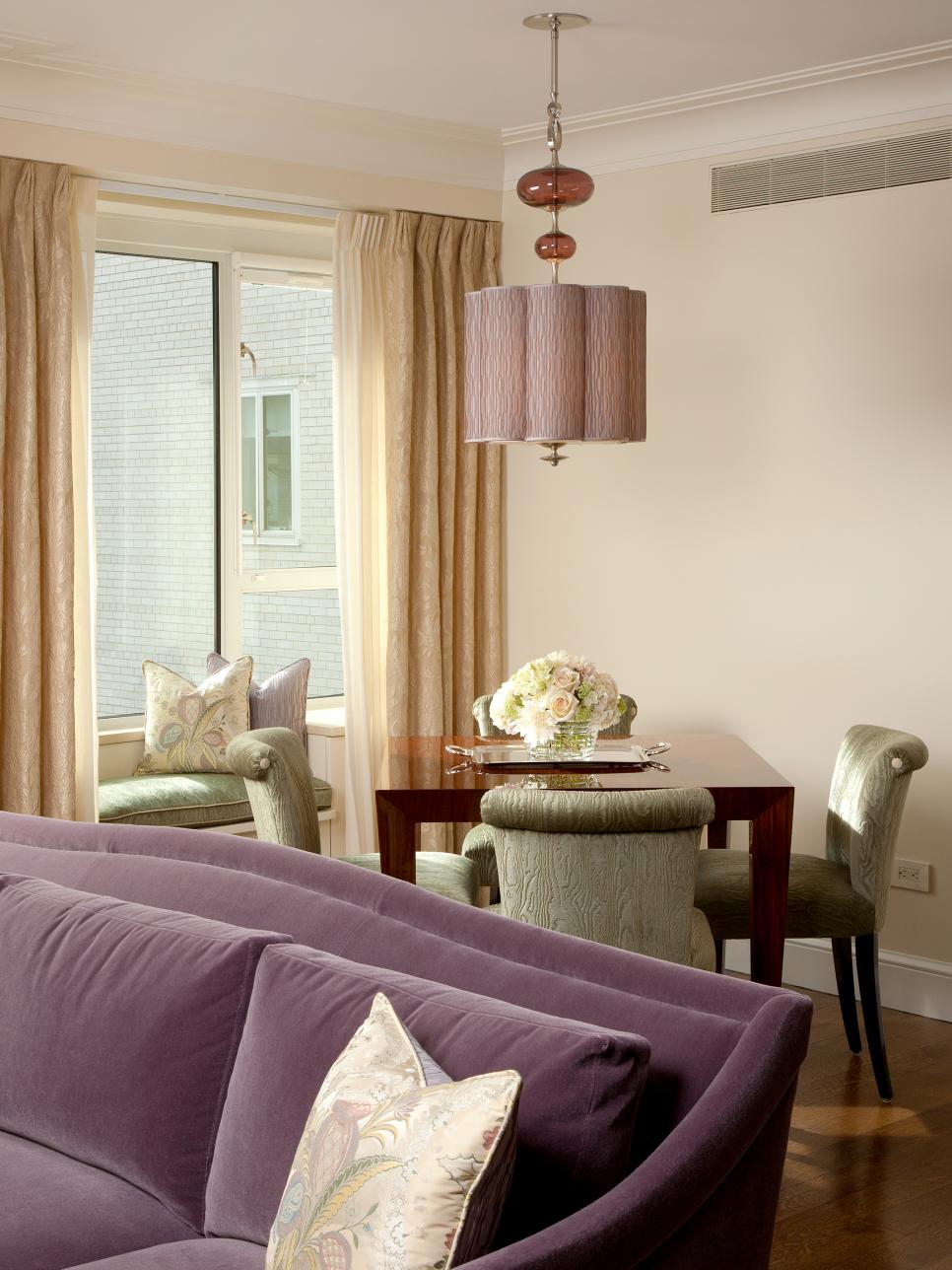 Neutral Living Room With Purple Sofa, Game Table and Window Seat