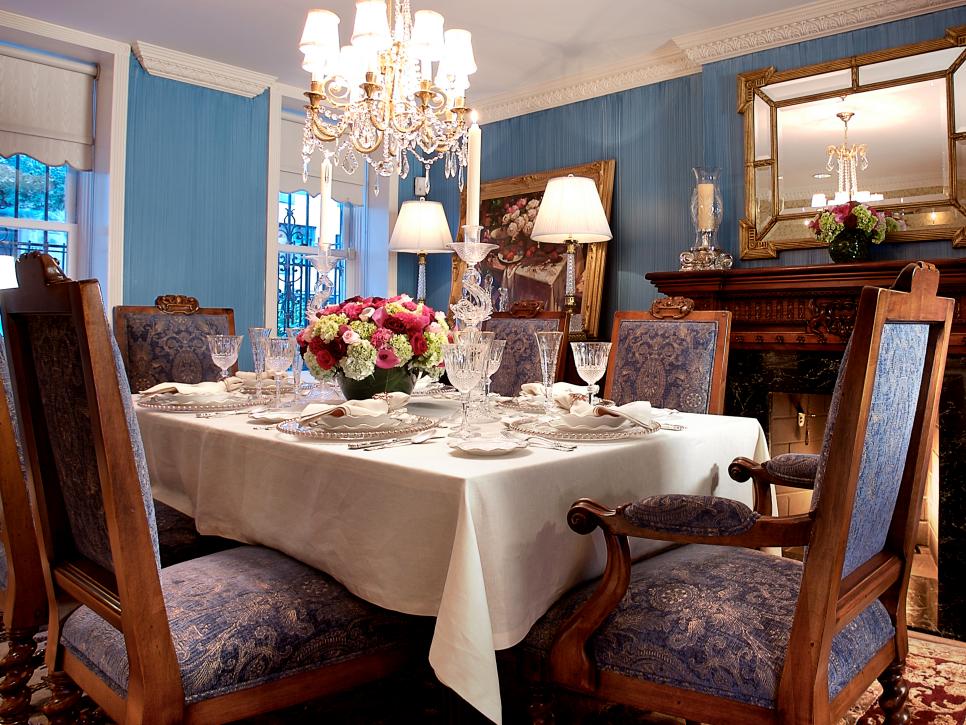 Formal Dining Area With Blue Chairs and Linen Tablecloth