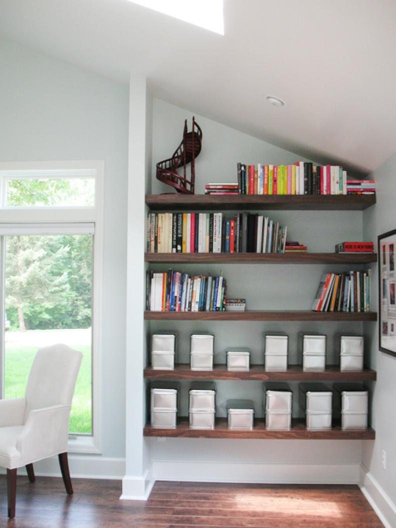 Brown Wood Shelves in Living Room Nook, with Sloped Ceiling.