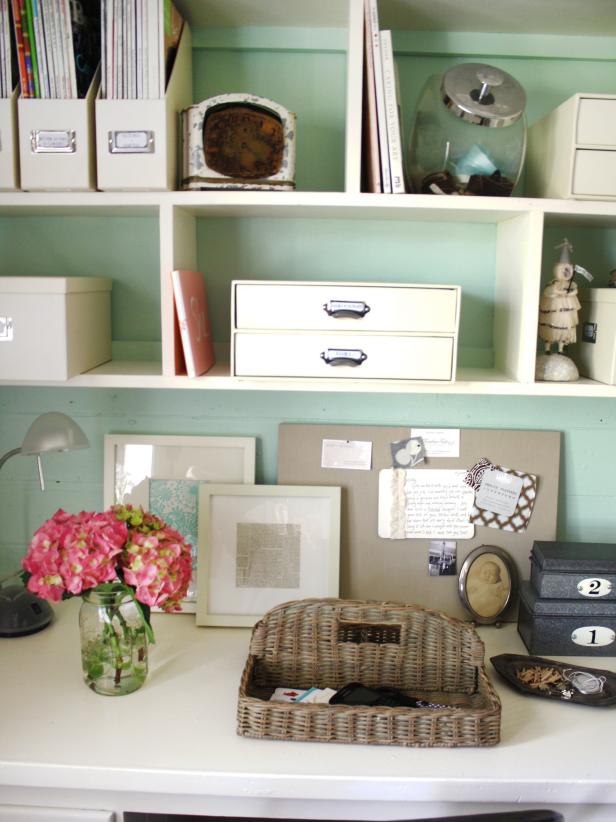 Labeled Boxes on White and Green Bookshelf