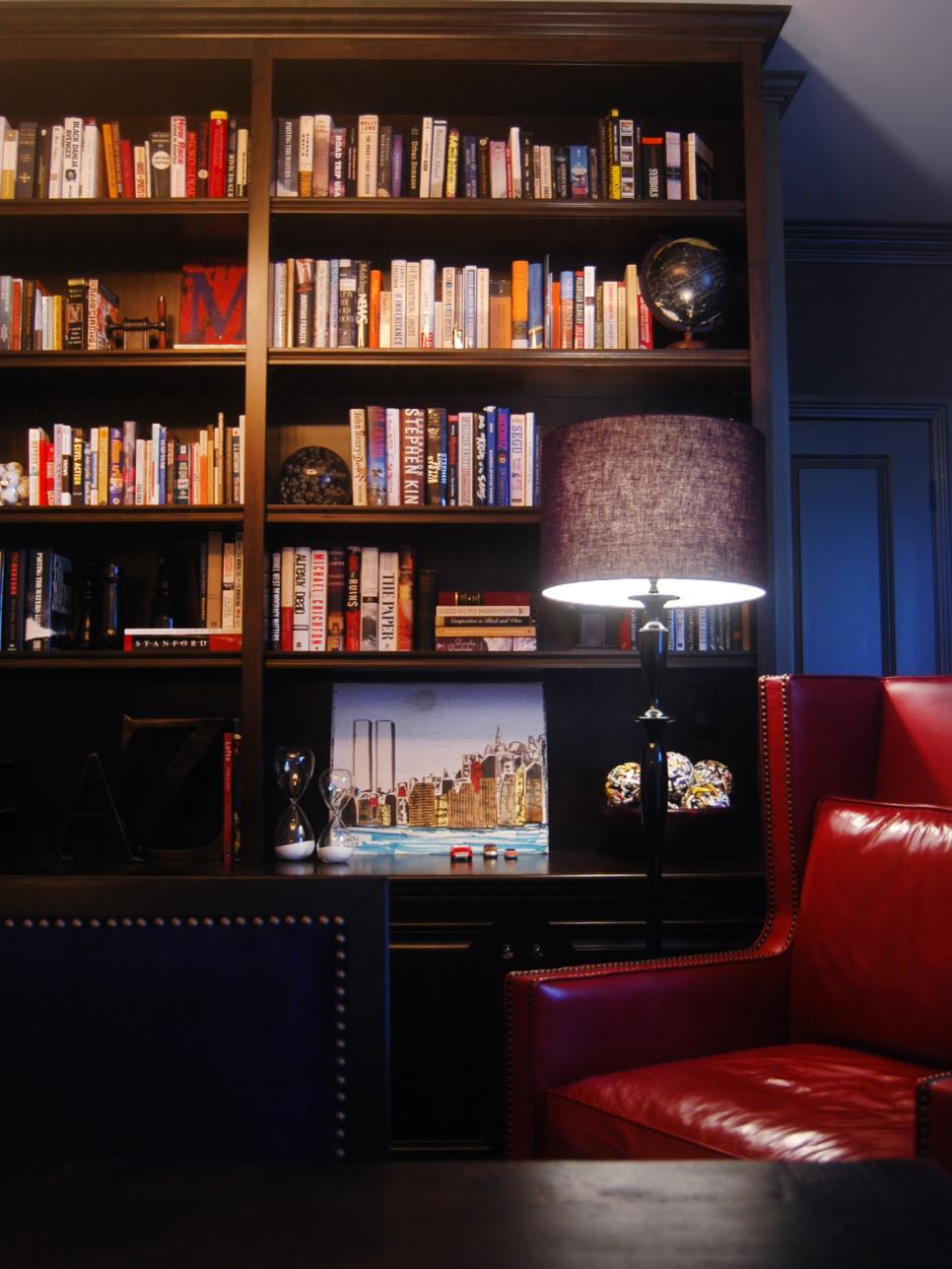 Wood Bookcase With Colorful Books and Red Leather Chair