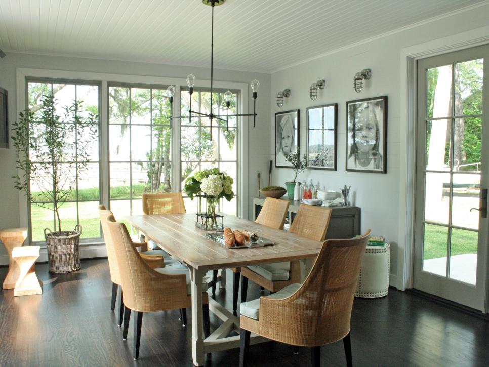 Country Dining Area With Wood Table, Wicker Chairs and Large Windows