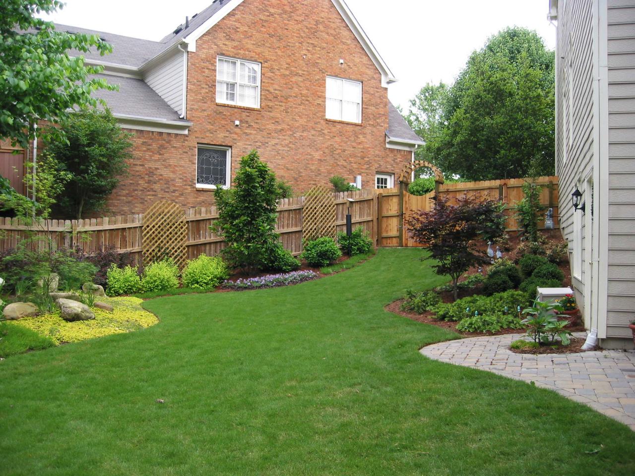 backyard border gardens around lawn this well manicured backyard also 