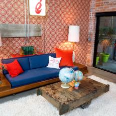 Living Room With Bold Wallpaper and Exposed Brick 