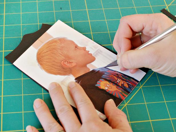 Place printed photo over black card stock and cut away background from printed image leaving only the subject's silhouette.