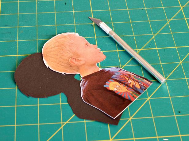 Place printed photo over black card stock and cut away background from printed image leaving only the subject's silhouette.