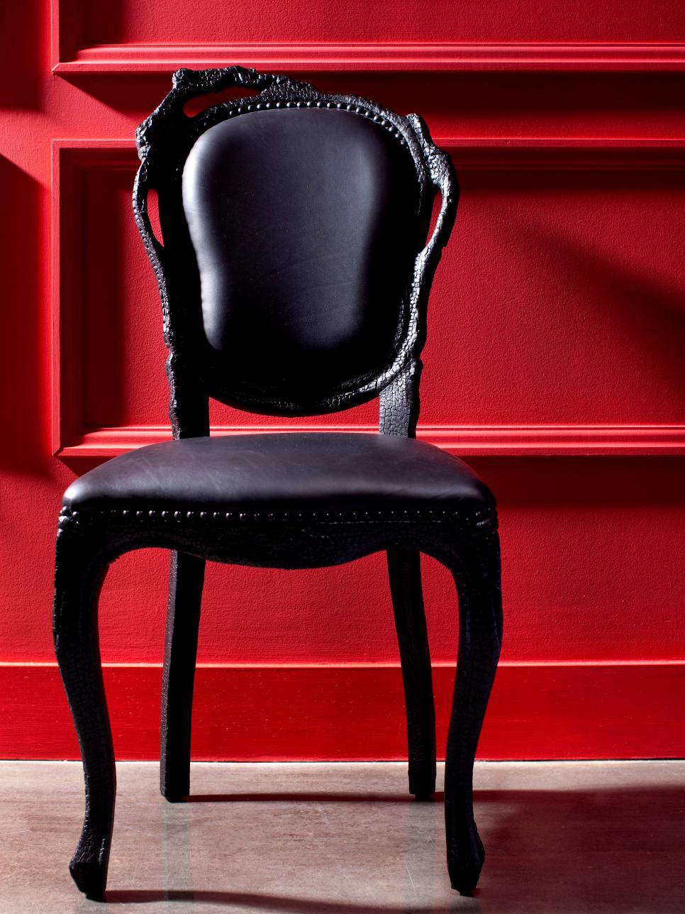 Red Wall and Black Chair