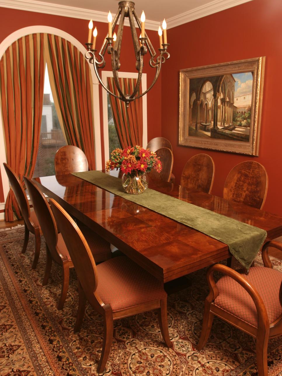 Red Transitional Dining Room With Arched Doorway Red Transitional Dining Room With Arched Doorway and Chandelier