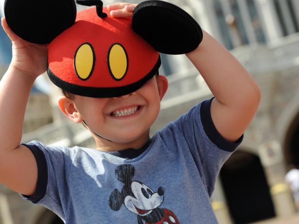 Child Wears Mickey Mouse Ears Child Wears Mickey Mouse Ears