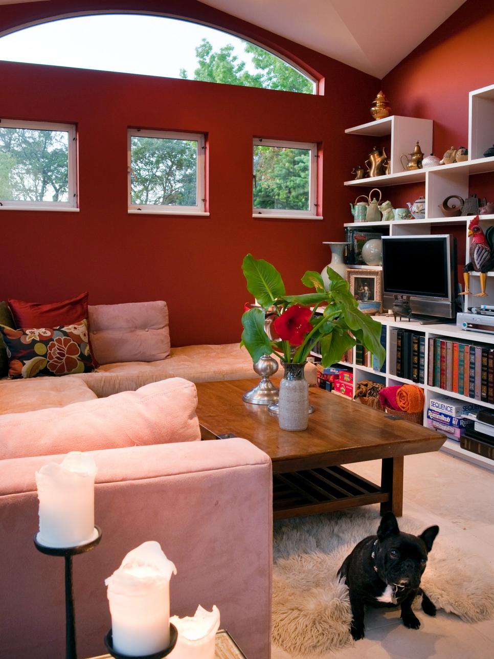 Contemporary Living Space with Red Walls and Built-In Shelves