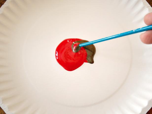 Mix equal parts red and burnt umber acrylic craft paint for the advent calendar numbers.