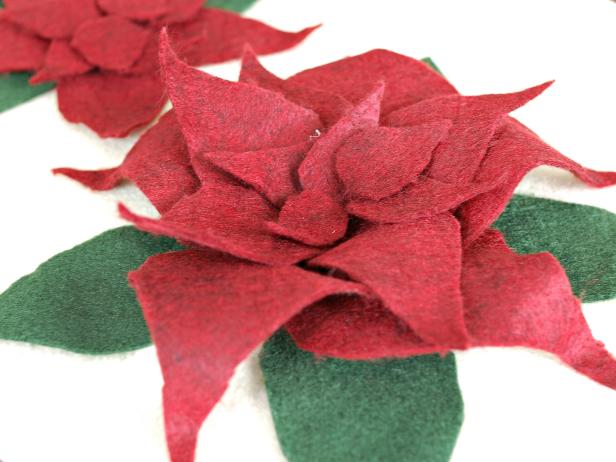 Repeat with the other large petals. Layer medium-sized petals on top of the largest ones, with glue only applied to base. Use this same process with the smallest petals.