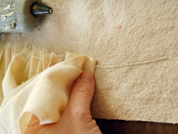 Preheat hot glue gun. Apply a line of hot glue approximately 1 1/2 inches from outside edge of skirt. Create ruffles by pinching linen with fingers and pushing gathers down onto hot glue.