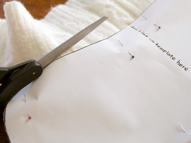 Line up template with sweater's natural grain before cutting.