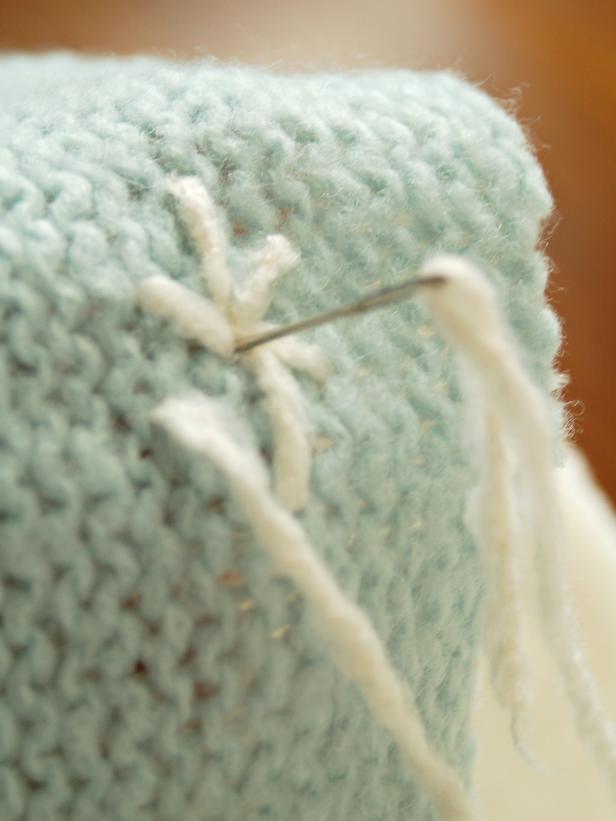 Detailed stitching on sweater stocking will add character, texture, and the ability to personalize. Use a contrasting color to make your "knitting" work stand out!