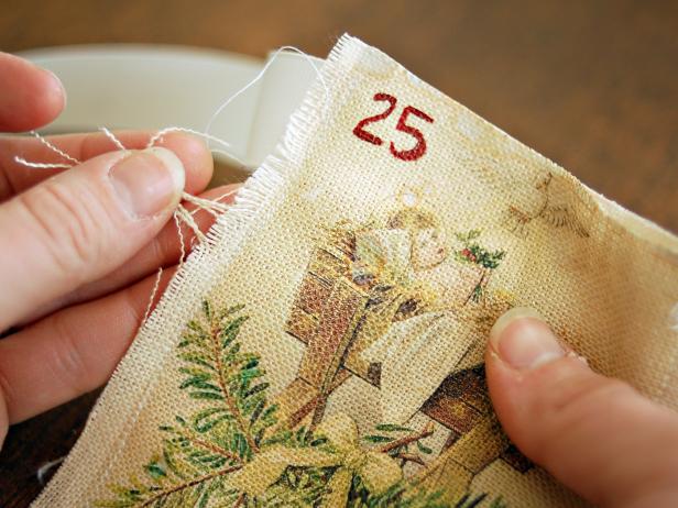 Gently pull threads from pocket edges to create a frayed border.