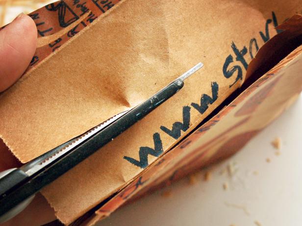 Measure and cut a 3" x 3/4" pennant-shaped piece out of a brown paper bag and cut a small triangle out of right end.