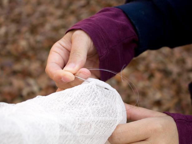 Thread Fishing Line Through Arms Of Halloween Ghost Thread Fishing Line Through Arms Of Halloween Ghost