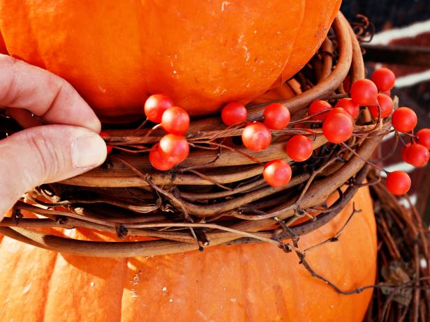 Use wire cutters to snip small springs off of larger bittersweet stems. Insert cuttings into grapevine wreaths.
