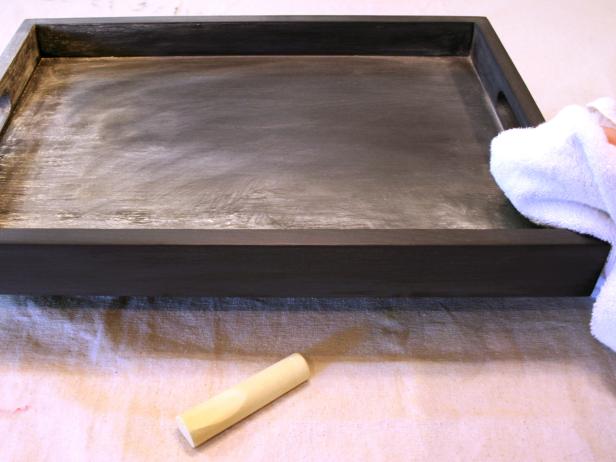 Rub chalk into surfaces then wipe away with a towel. Complete your spooktacular tray with your favorite Halloween phrase or a message to your guests.