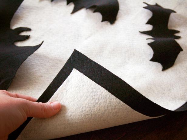 Crisp cream and black complement each other on a Halloween applique pillow.