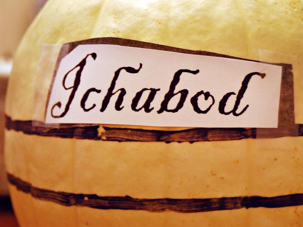 Placing Transfer Paper Lettering On Halloween Pumpkin Placing Transfer Paper Lettering On Halloween Pumpkin
