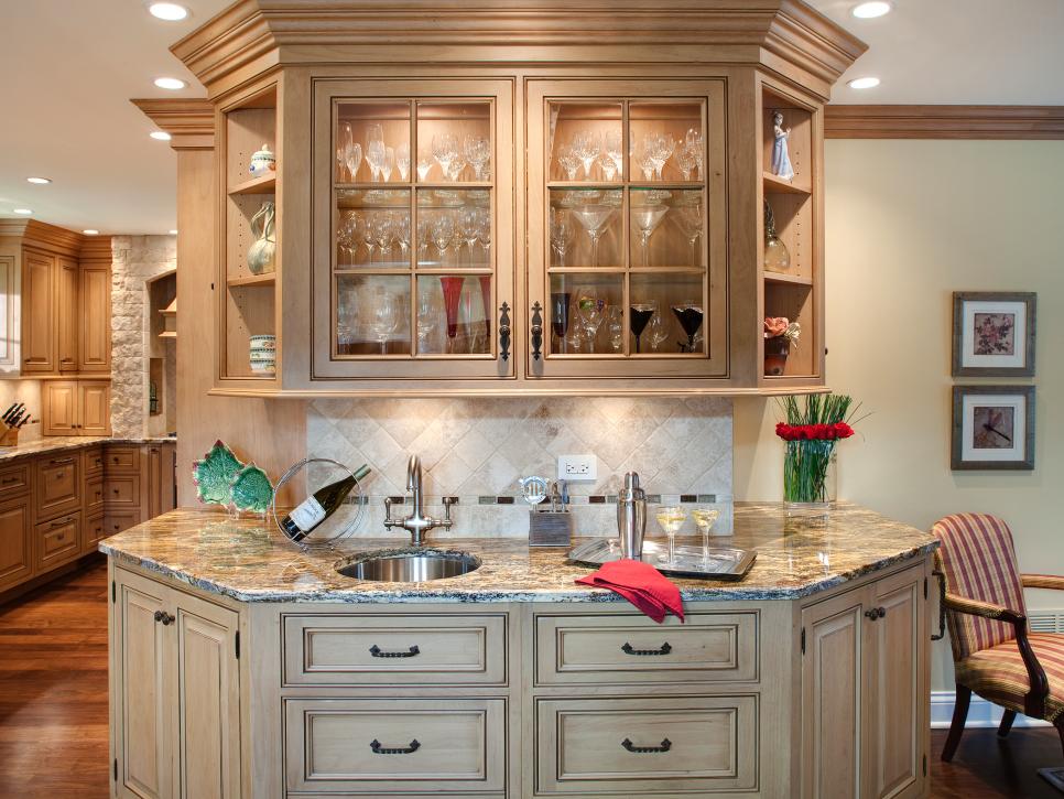 Wet Bar With Antiqued Cabinets and Granite Countertops