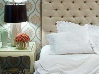 Bedroom With Blue and Gold Pattern Wallpaper and Tufted Headboard