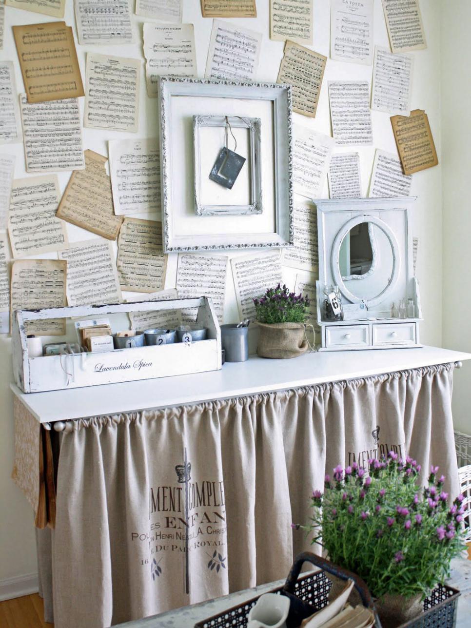 French Country Sideboard With Linen Skirt Skirted Table With Sheets of Music on the Wall