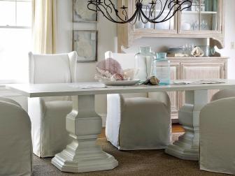 Large White Wood Dining Table With White Slipcovered Chairs 