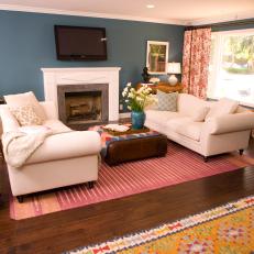 Red and Blue Living Room With a Pretty Pink Rug