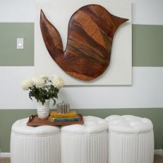White Pleated and Tufted Three-Seat Bench Against Striped Wall