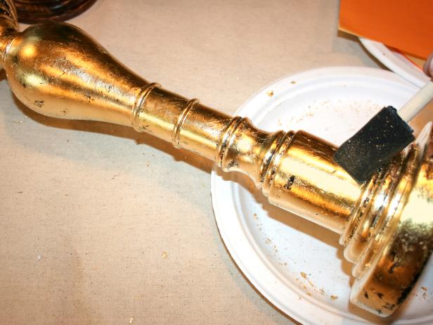 Brush off excess gold leaf particles.