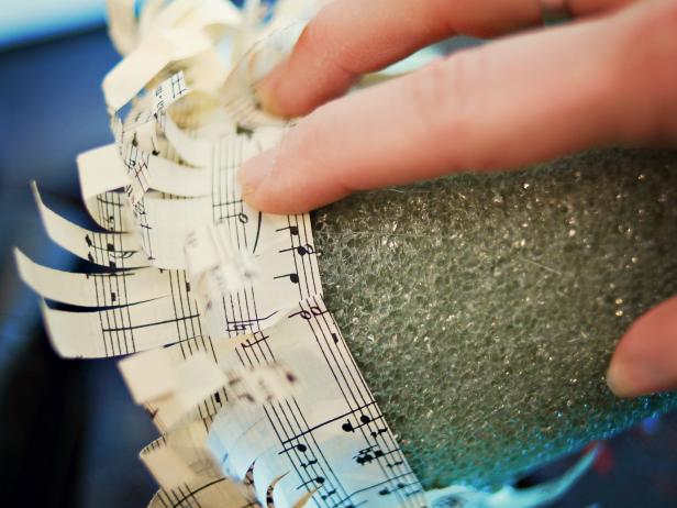 This sheet music strip is glued to a foam Christmas tree base.