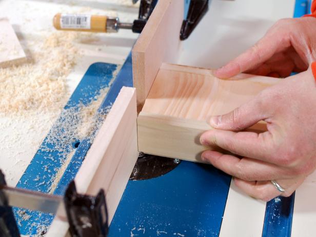 Run top and both sides of front edge of chalkboard plaque through router. The edge of this poplar wood base is routed to make a chalkboard stocking hanger.